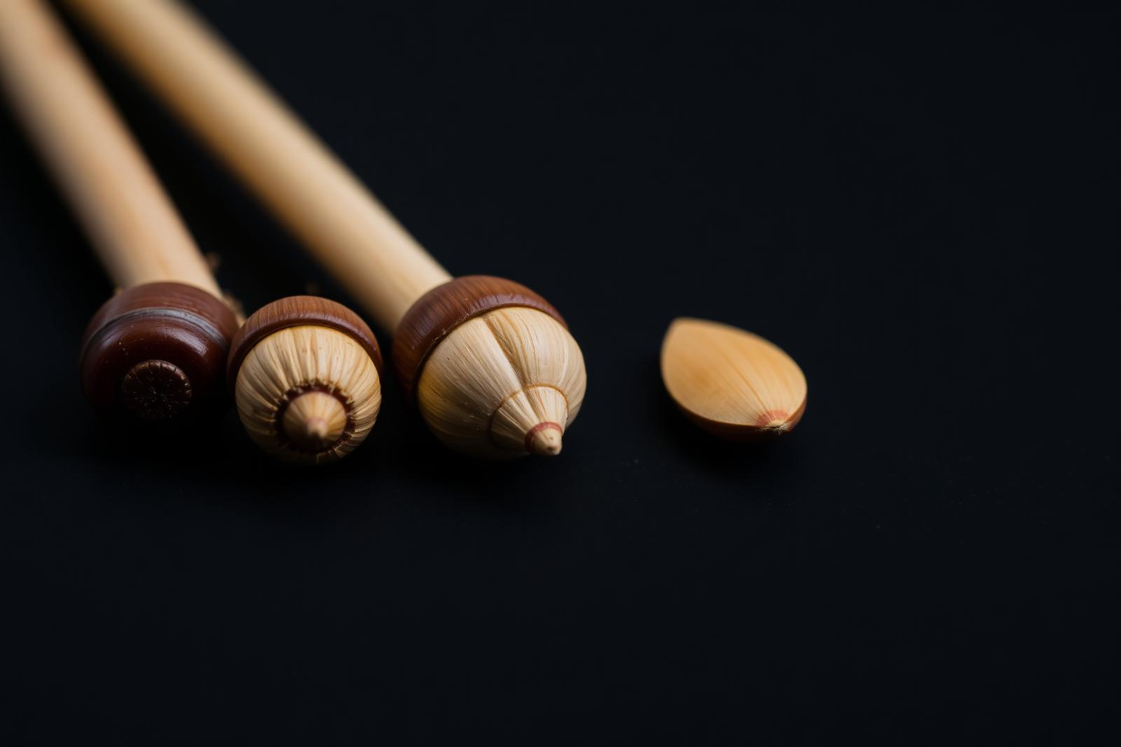 Macro shot of different drumstick tip shapes — oval, acorn, barrel